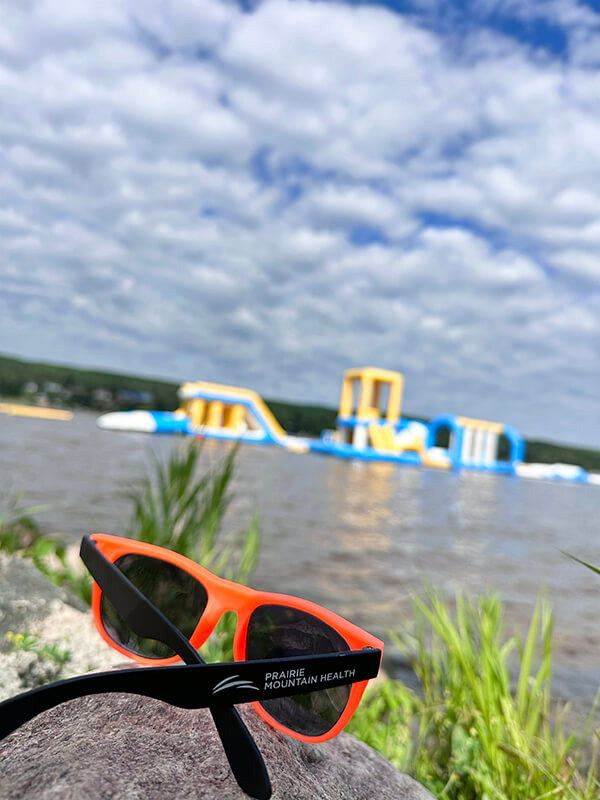 Sunglasses on rock at beach