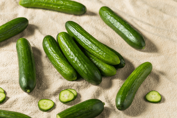 cucumbers on brown cloth