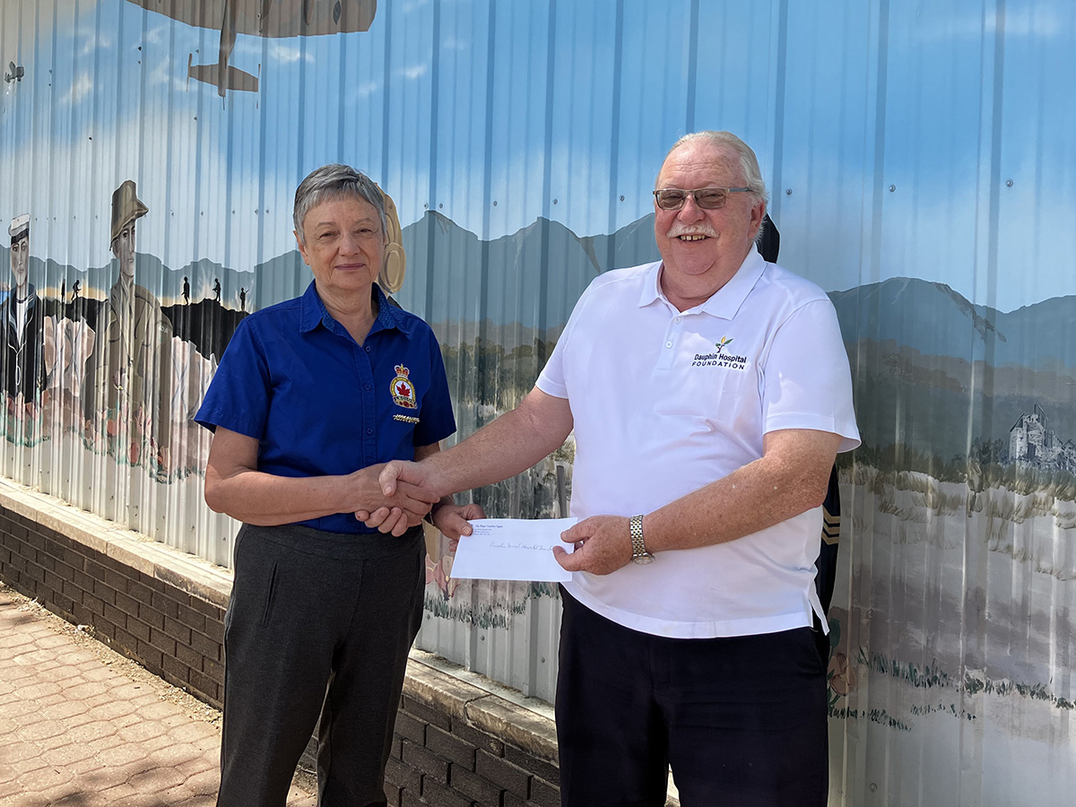 Norma Johnson, Dauphin RCL Poppy Fund Chair, presents donation to Greg Thompson, Chairperson of the Dauphin Hospital Foundation. 