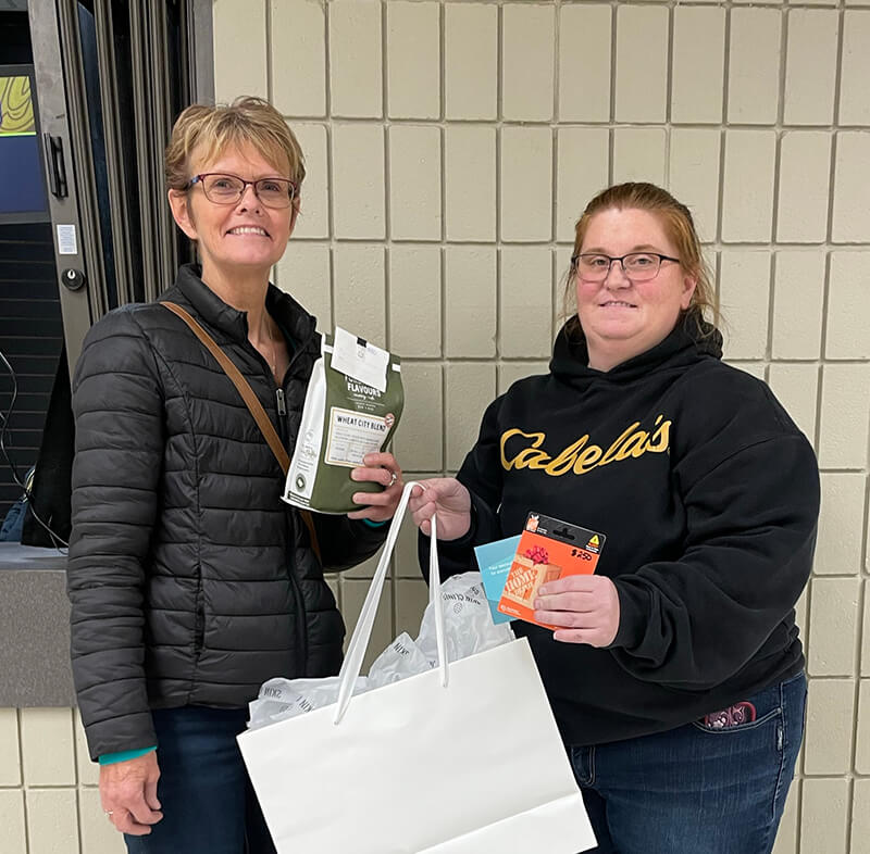 Marilyn and Lacey with prize package