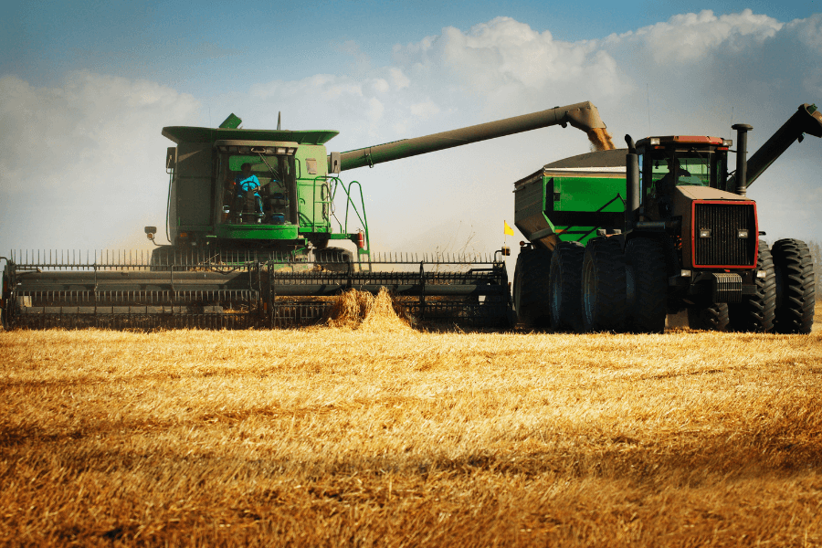 Combine dumping into grain cart.